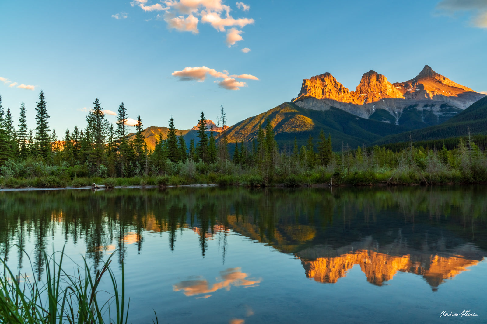 Fine art print of the three sisters mountain range near sunset with Fisherman's Creek in the foreground in Canmore, Alberta Canada – landscape photography by Andrew Mease