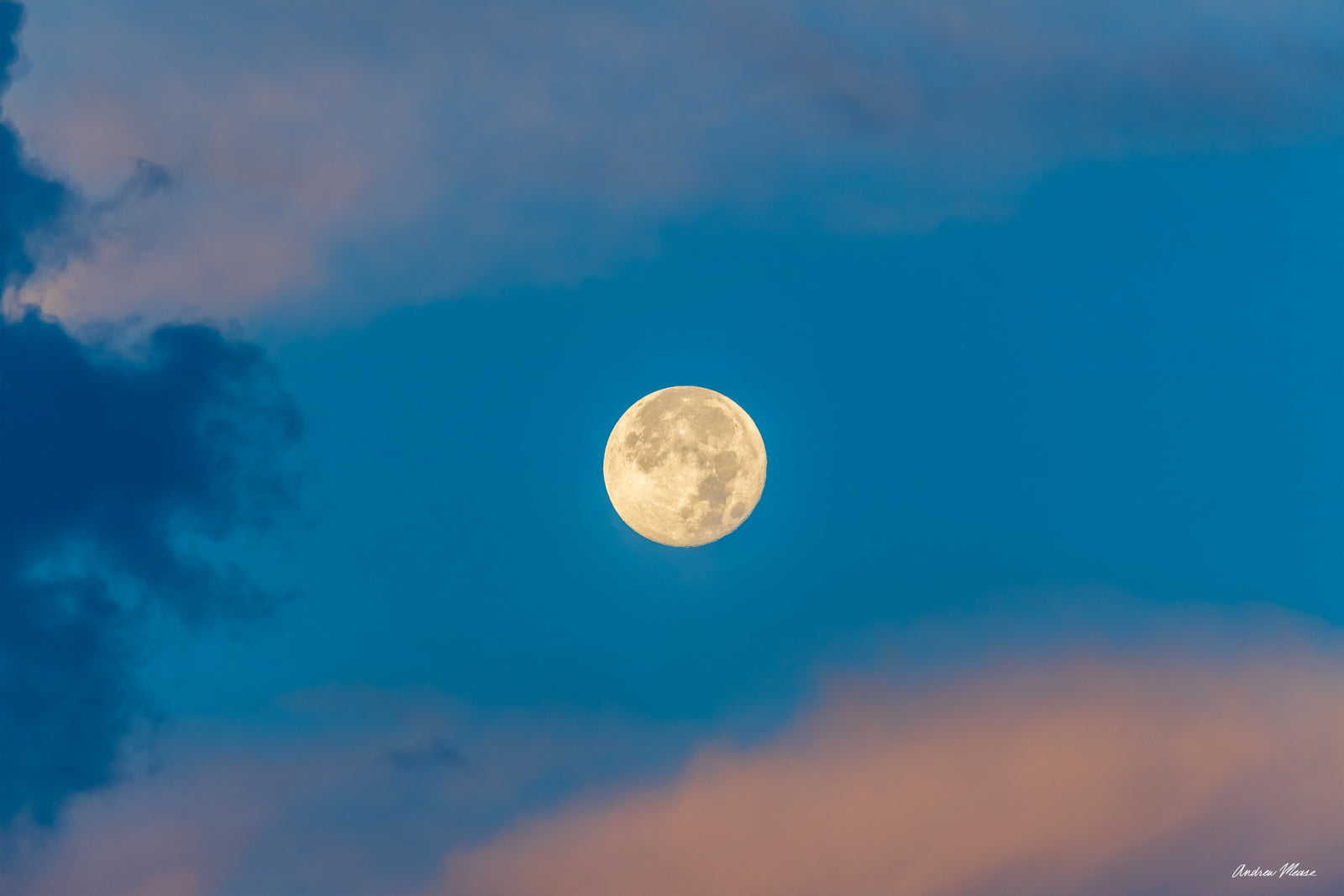 Fine art print of the moon along with some colored clouds after a rainstorm – landscape photography by Andrew Mease